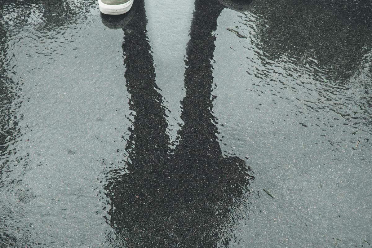 photo of reflection without subject, only shoes remains